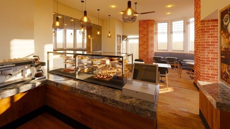 Pastry display counter with marble tables in the foreground