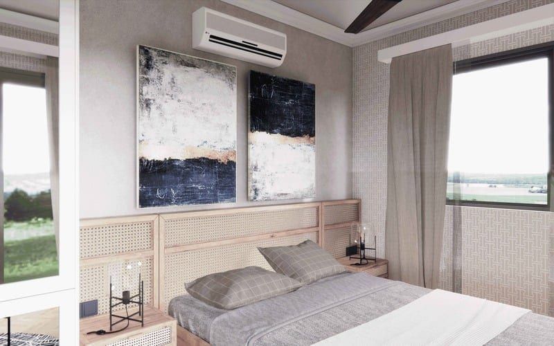 Bed beneath ceiling fan with sheer curtains